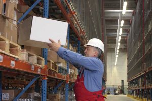 warehouse worker lifting heavy box