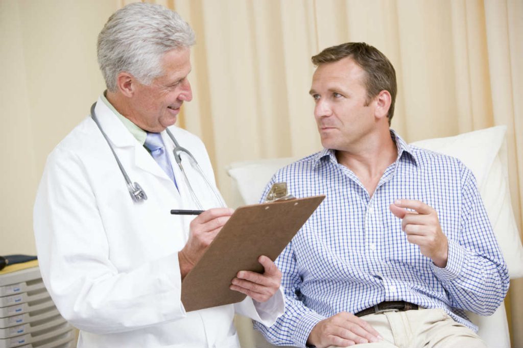 injured worker speaking with doctor